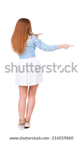 Back view of  pointing woman. beautiful redhead girl. Rear view people collection.  backside view of person.  Isolated over white background.