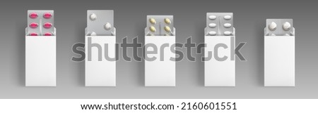 Blisters with medical drugs in open white boxes. Vector realistic mock up of 3d pharmacy package, round and oval pills and tablets in blank carton packs. Template of medicaments wrapping Royalty-Free Stock Photo #2160601551