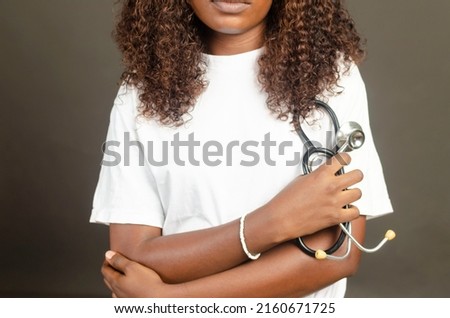 health concept. cropped portrait of black African female holding medical stethoscope