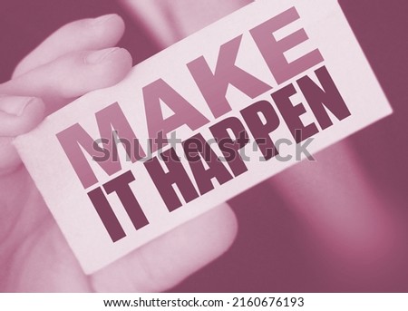 Make It Happen card in businessman hand. Business concept.