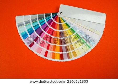 Color palette,color catalog on orange background Royalty-Free Stock Photo #2160681803