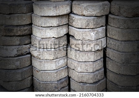 Pile of old bricks for pavement, pattern background