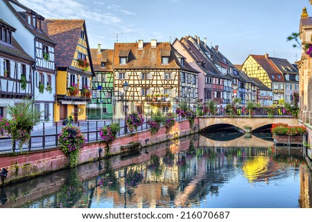Colorful traditional french houses on the side of river Lauch in Petite Venise, Colmar, France Royalty-Free Stock Photo #216070687