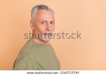 Profile photo of serious elder white hairdo man wear grey pullover isolated on beige color background