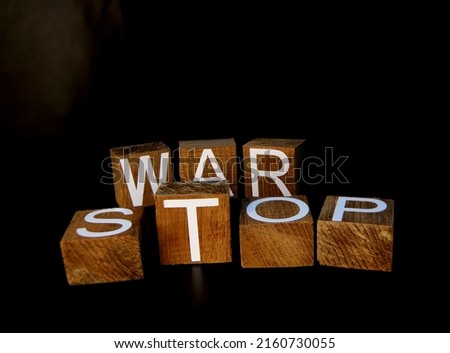 The letters on the square shape are arranged as the word "stop the war".