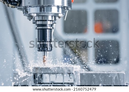 Working closeup CNC turning cutting metal Industry machine iron tools with splash water. Royalty-Free Stock Photo #2160752479