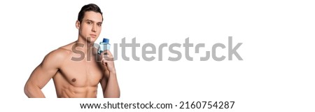 shirtless man with strong body holding perfume and looking at camera isolated on white, banner