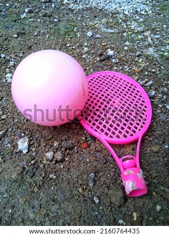 ping color plastic racket and ball, in the daytime