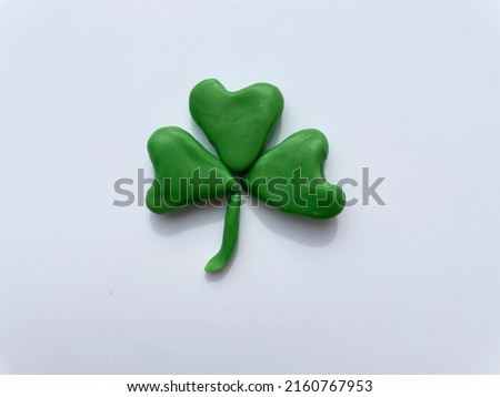 plasticine clover leaf on white background