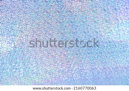 Holographic iridescent abstract glitter background in blue purple color with fine blurred texture Royalty-Free Stock Photo #2160770063