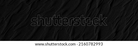 Black and white poster texture sand in the desert. Panaroma Sand texture. abstract texture line wave. Sand Waves Abstract Black and White background. Volcanic rock texture. Black salt. Black Sand.