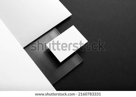 Black branding stationery mockup template, with trendy reeded glass elements, real photo, letterhead, folder, business card. Blank isolated on a black background to place your design