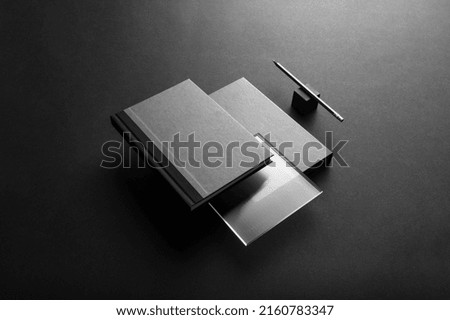 Black branding notebook, brochure with packaging mockup template, with trendy reeded glass, real photo. Blank isolated on a black background to place your design
