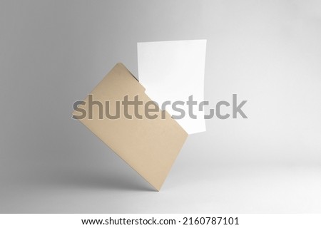 Floating folder and A4 letterhead, branding stationery clean mockup template, real photo. Blank isolated on white background to place your design. 