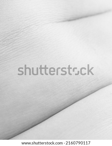 Female body texture. Close-up image of woman's body, plaits. Black and white image. Body art. Concept of beauty, textured effect, self-love, acceptance. Design for abstract artwork, picture, poster