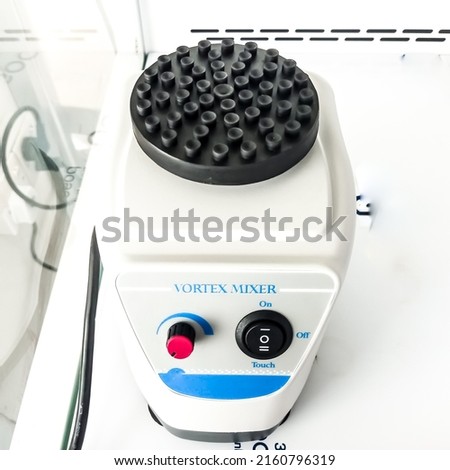 A magnetic vortex mixer isolated in serology departmentPCR lab. Digital Rotator. Closeup. Royalty-Free Stock Photo #2160796319