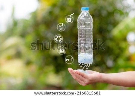 The process of cutting plastic bottles into flakes or small pieces of plastic. and bring it to the next recycling process. Recycle icon, sustainable icon and Bottle icon. Chemical concept Royalty-Free Stock Photo #2160815681