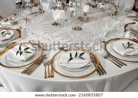 Table set for wedding or another catered event dinner. Royalty-Free Stock Photo #2160835807