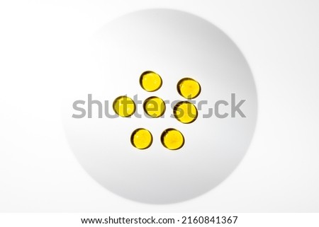 Yellow glass pearls with shaded vignette on white background