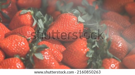 Close-up of a selective focus of ripe strawberries on the counter. Strawberries are sold in boxes as a healthy food. Top view of delicious, fresh, juicy strawberries, just picked. Juicy berries. Royalty-Free Stock Photo #2160850263