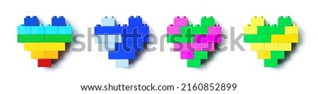 Set of four Colored Hearts from Legoblocks isolated on white background, colorful figure plastic blocks, shapes heart of child construction. Toys, games and recreation, top view design elements