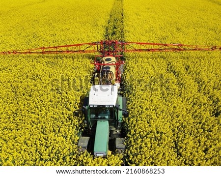 On a field in Goslar in the suburb of Vienenburg am Nordharz in the state of Lower Saxony, a farmer uses a field sprayer to apply crop protection against fungi to flowering rapeseed.