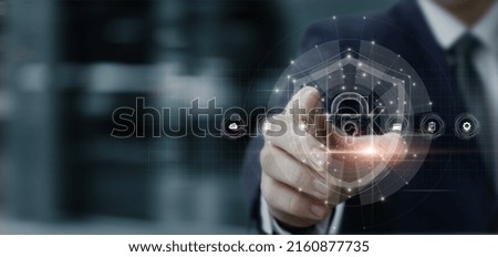 Businessman installs System protection on virtual computer screen.