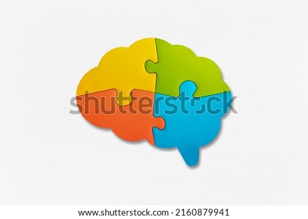Brain shaped jigsaw puzzle on white background. Human mind complexity. 