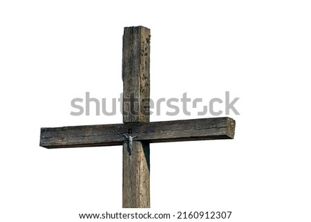 An old wooden cross on an isolated white background. The crucified Jesus on the cross. The concept of the pure and unrequited love of God Jesus Christ for man.