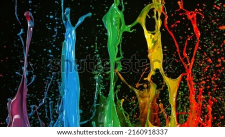 Freeze motion of dancing colors, isolated on black background