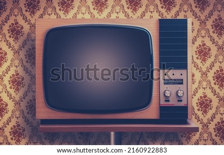 Retro TV In A Room With Ugly 1970s Vintage Wallpaper Royalty-Free Stock Photo #2160922883