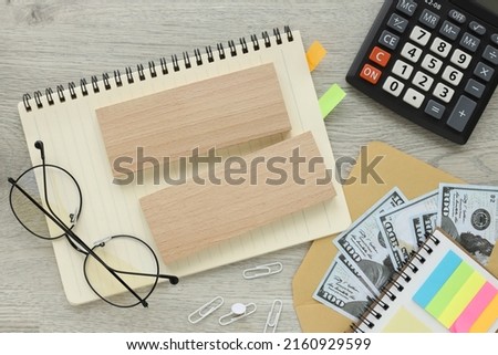wooden blocks on an open notepad on the desktop