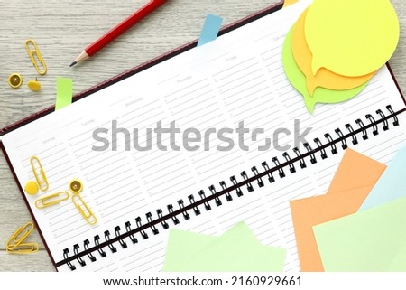 notebook, open notepad. planner. pencil, sticky paper, ready to meet and write down an amazing idea