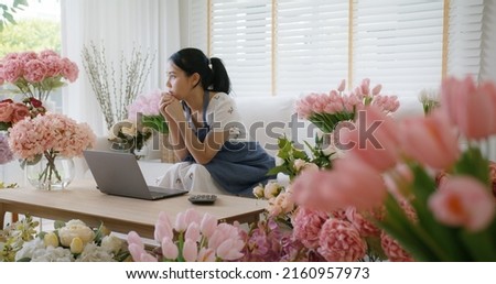 Asia people young woman thoughtful looking away doubtful stress worry in bad news financial economy recession cash flow crisis in small SME issue impact from covid coronavirus at home office store. Royalty-Free Stock Photo #2160957973