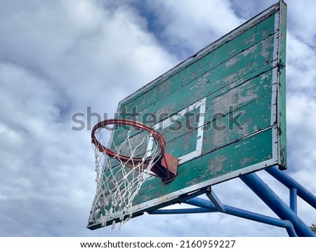 Old basketball backboard ring and net