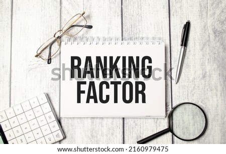 text RANKING FACTOR with calculator, pen and magnifier