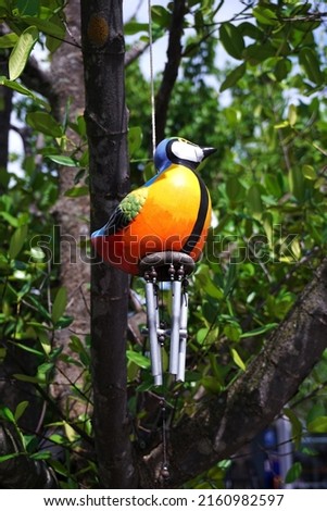doll hanging mobile  orange ceramic bird  hanging on the branch