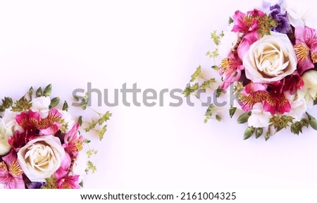 Yellow roses and pink alstroemeria in a festive bouquet on a white background. Background for a greeting card.