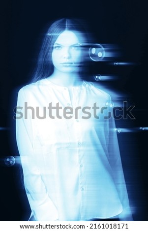 Fantasy, illusion and sci-fi concept. Abstract beautiful woman portrait in blue neon futuristic glitch hologram effect. Flying bubbles looks like space stars or glitch. Bright vivid filter applied