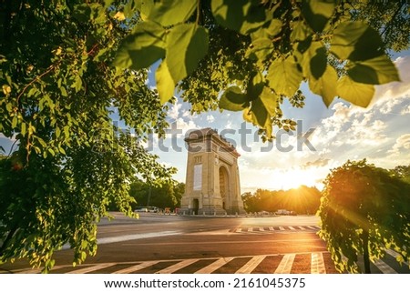 Sunrise in Bucharest with view to Arch of Triumph landmark building. Amazing color in the morning. Travel to Romania. Royalty-Free Stock Photo #2161045375