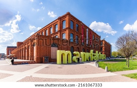 A picture of the sign of Manufaktura, an old industrial complex, in Łódź.