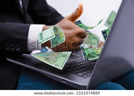 100 Bulgarian lev notes coming out of laptop with Business man giving thumbs up, Financial concept. Make money on the Internet, working with a laptop