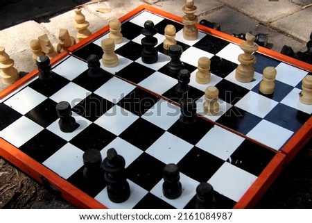 Wooden chess board on table background