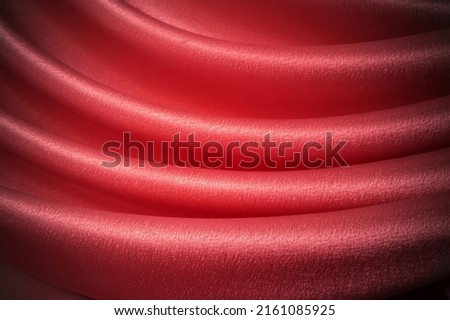 Close-up red curtain. Beautiful theater curtain background photo.