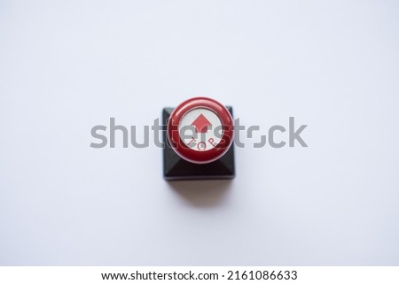 stamp with red handle, arrow and top words isolated on white