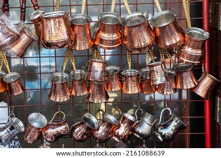 Antique Turkish coffee pots which made of copper on an outdoor souk in the city of Gaziantep