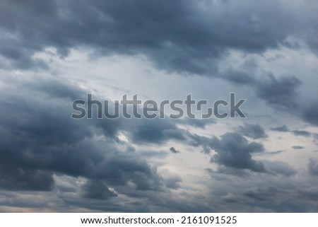 Summer cloudy dramatic rainy sky background. Panoramic view with beautiful clouds. Horizontal cloudscape. High-resolution photography. Design element. Copy space. 