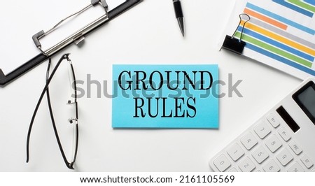 Stickers with chart,calculator and paper with text GROUND RULES on white background