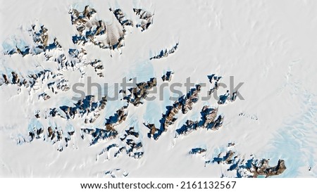 Meteorite Hotspots in Antarctica, exploration on the continent's ice, top view of snow peaks in Antarctica background texture concept, Rocks on snow surface.  Royalty-Free Stock Photo #2161132567