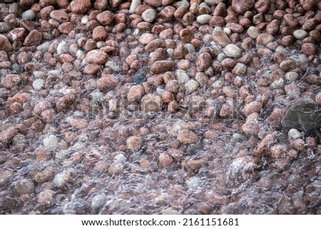 round sea pebbles, background, text.